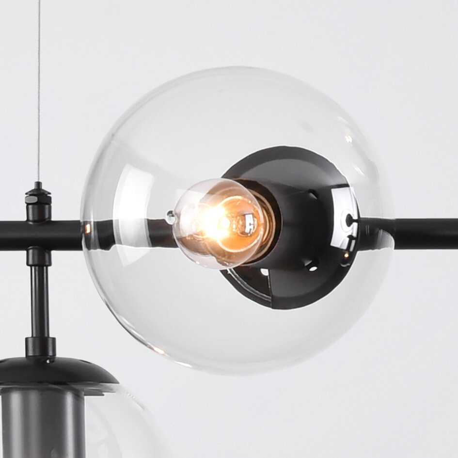 Pendellampa Hepta med sju lampor - transparent glas och svart