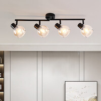 Taklampa Pela med fyra lampor - amberfärgat glas och svart med vridbara spotlights