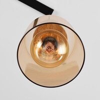 Pendellampa Naki med tre lampor i travertin (natursten) och amberglas