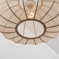 Justerbar vägglampa Brandel med rund tygskärm i ljusbeige