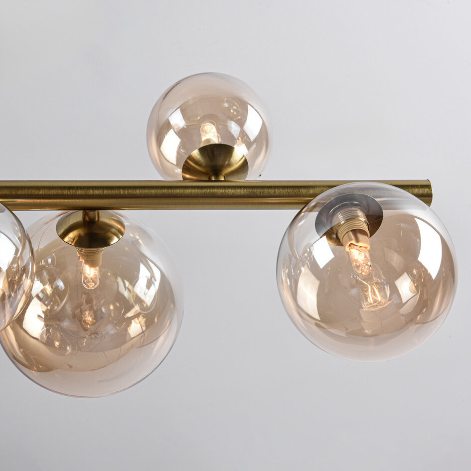 Pendellampa Ennea med nio lampor - guld och amberfärgat glas