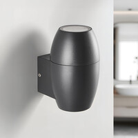Oval badrumsvägglampa med en lampa i svart