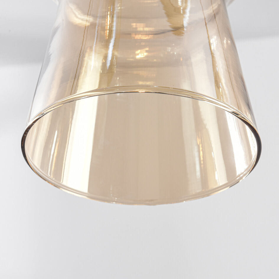Pendellampa Cael med åtta lampor - guld med amberfärgat glas