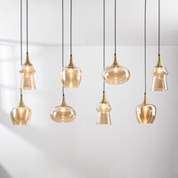 Pendellampa Cael med åtta lampor - guld med amberfärgat glas