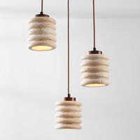 Cylinderformad pendellampa Alva med tre lampor i travertin (natursten)