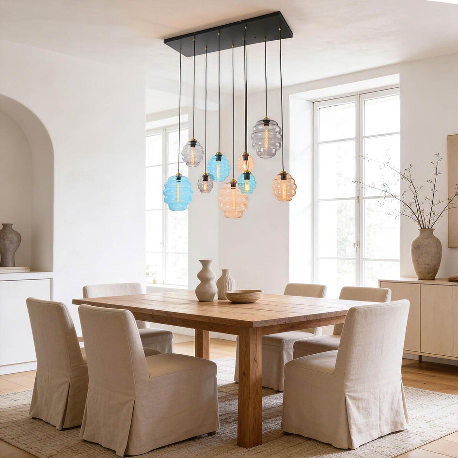 Designad pendellampa Zavari med 9 glaskulor i amber, rökfärgat och blått
