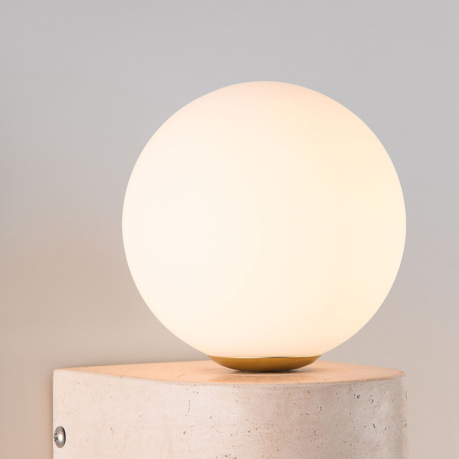 Vägglampa Alessa - travertin (natursten) med glaskula