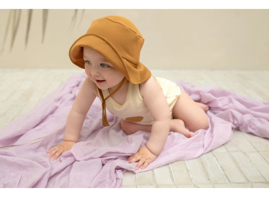 Phil&Phae | Sleeveless frotté onesie suns buttercream