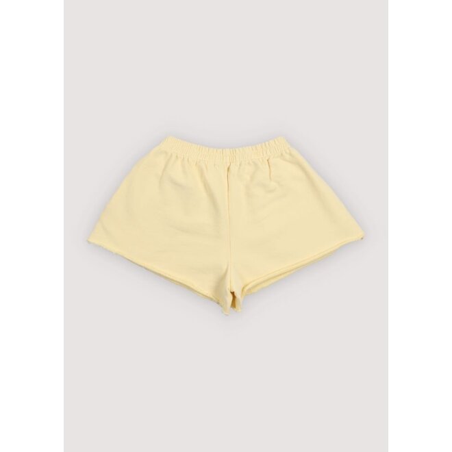 The New Society | TNS Logo Short Soft Lemon