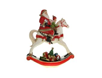 Kerstman met kind op hobbelpaard | polyresin | 18cm