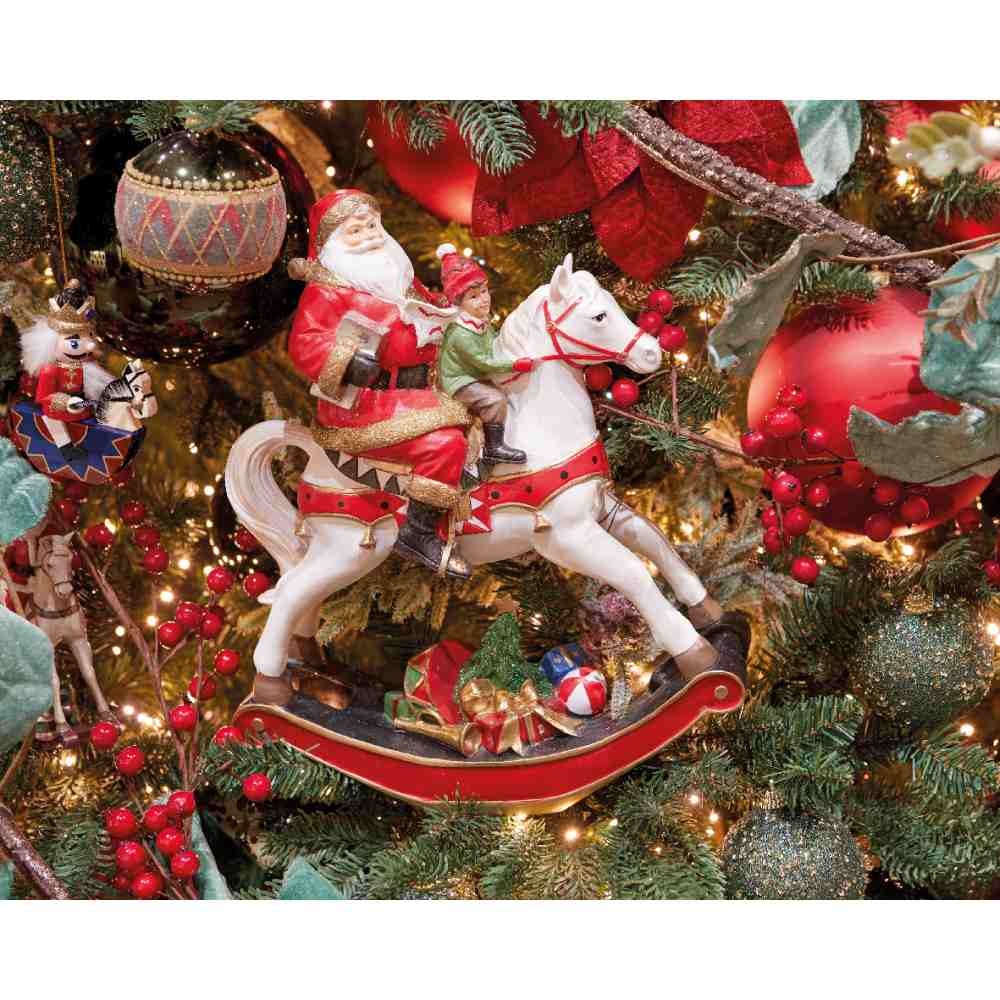 Kerstman met kind op hobbelpaard | polyresin | 18cm