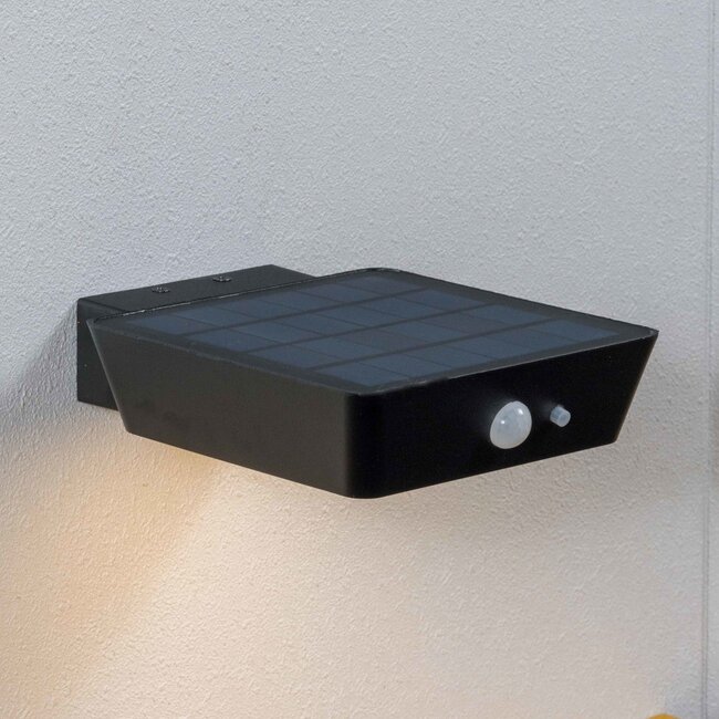 Modern solar wall lamp with sensor black - Shiny