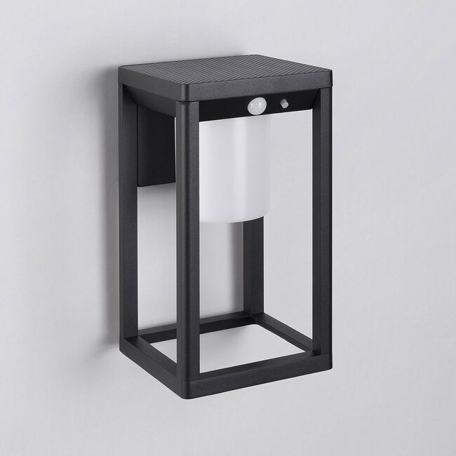 Solar outdoor wall light with sensor in black - Lucian