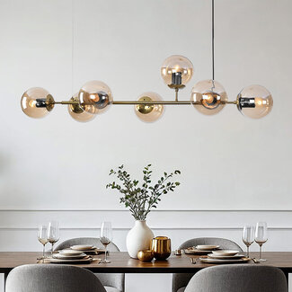Sette pendant lamp design with amber glass spheres