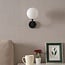 Wall light Runda - opal glass and black