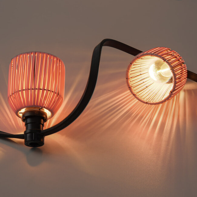 Pink Festoon lighting cable cover with rattan look