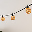 Festoon lighting cable shade in light rattan look