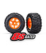 Traxxas Tires & wheels glued (X-TRUCKS orange wheels Maxx® AT tires with foam inserts) (left & right) (2) TRX7772T