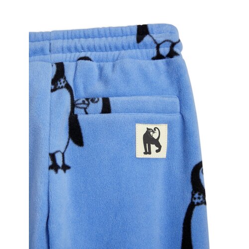 Mini Rodini Blauwe fleece broek met all-over pinguin print