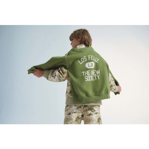 the new society Groene sweater met opdruk