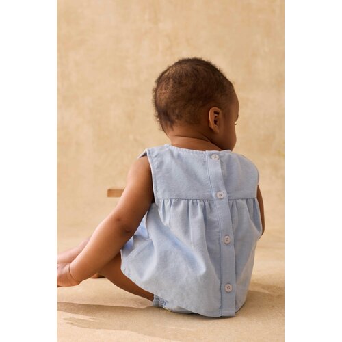 Louise Misha Blauwe baby blouse met geborduurde bloemetjes