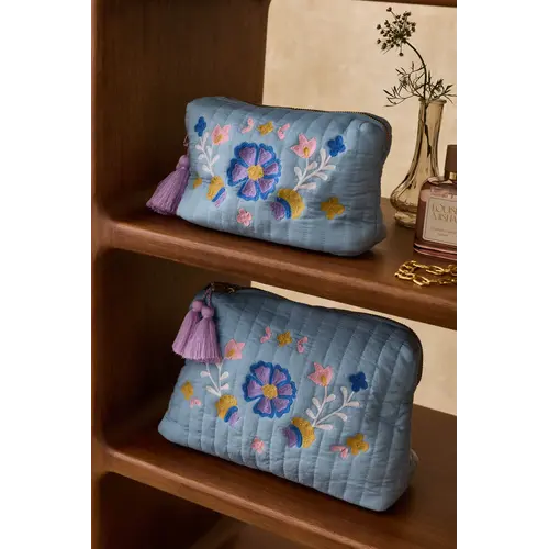 Louise Misha Blauwe toilettas met bloemen print
