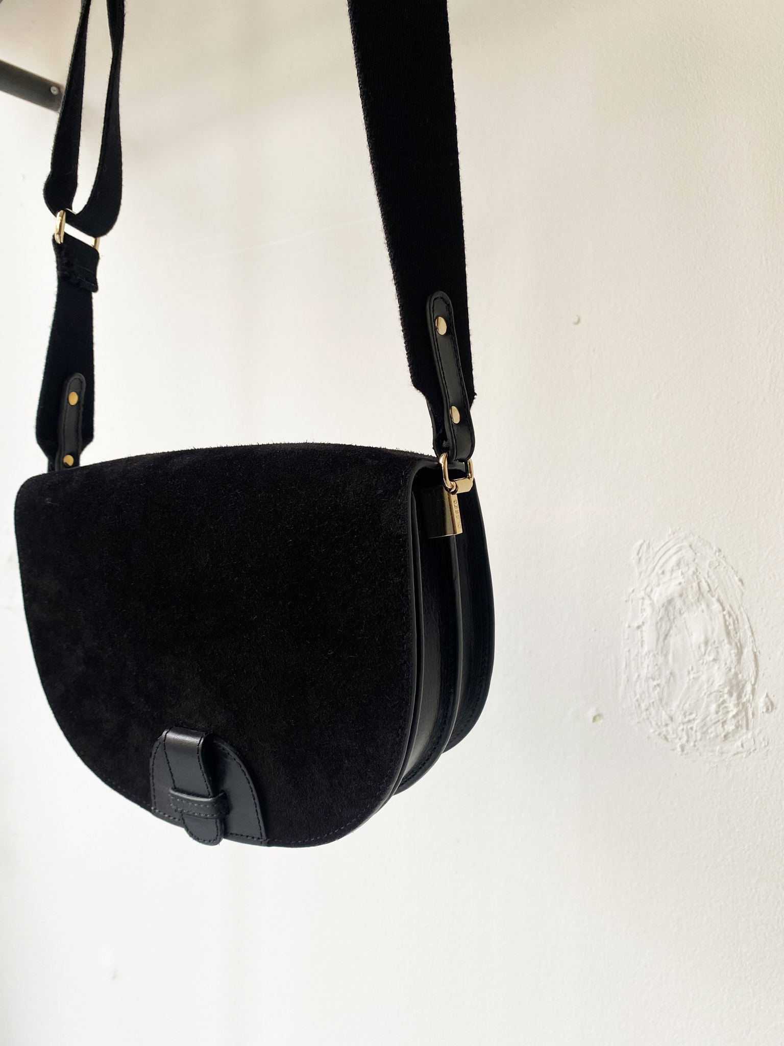 Closed black suede shoulder bag