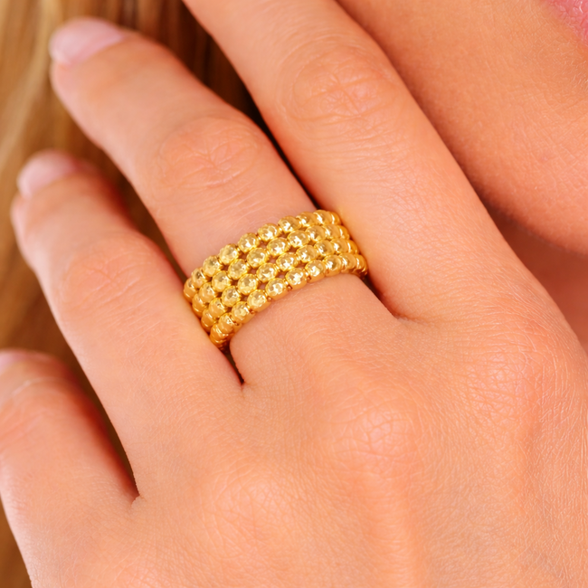 Elegante gouden ring met dorika balletjes