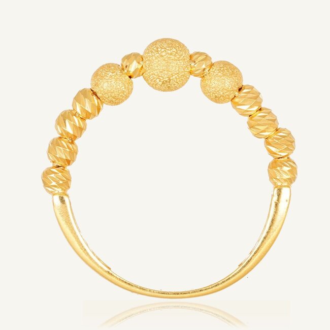 Elegante dorika ring met geslepen en matte bolletjes