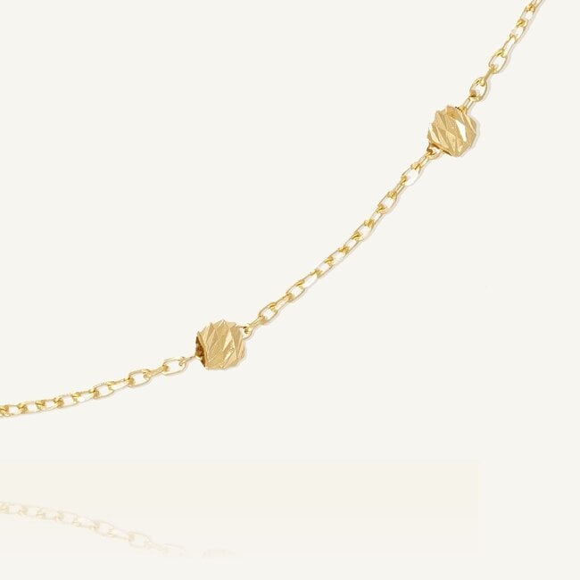 Gouden Dorika Armband met Geslepen Bolletjes