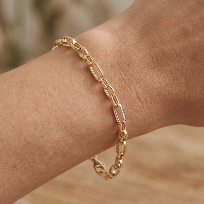 14k gouden schakelarmband met witgoud detail