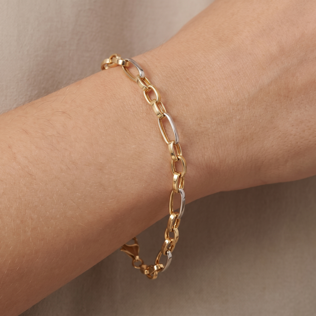 14k gouden schakelarmband met witgoud detail
