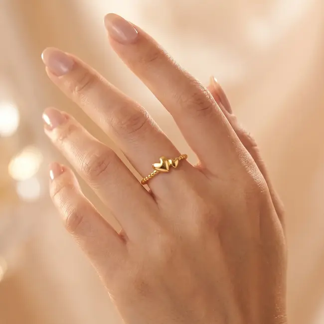 18k gouden bolletjesring met dubbel hart