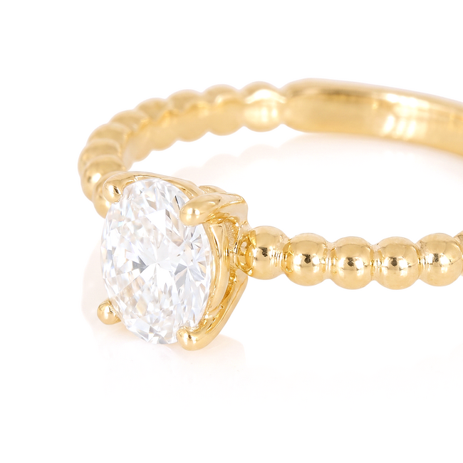 Gouden ovale solitaire ring met bolletjes