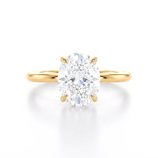 Gouden solitaire ring met grote ovale steen en design