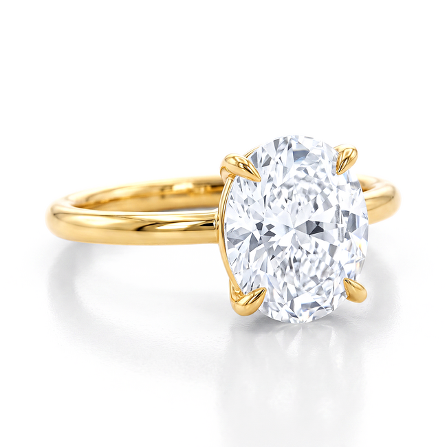 Gouden solitaire ring met grote ovale steen en design