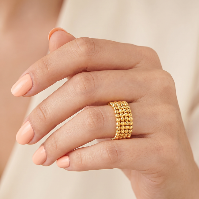 Elegante gouden ring met dorika balletjes