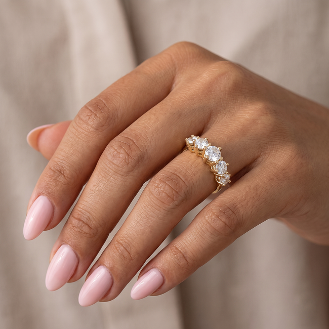 Gouden trinity ring met fonkelende zirkonia
