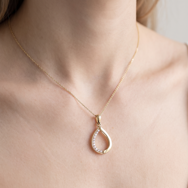 Gouden druppel hanger met zirkonia stenen