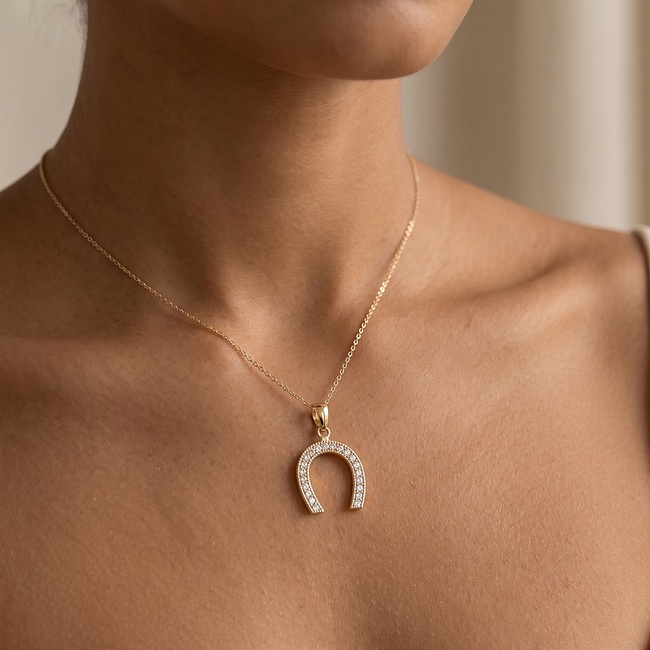 Gouden hoefijzer hanger met witte zirkonia