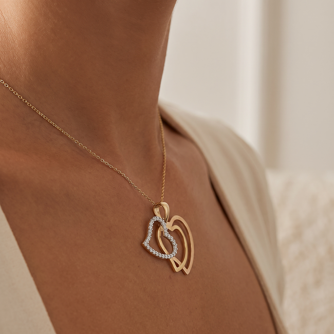 Gouden dubbele hart hanger met witte zirkonia