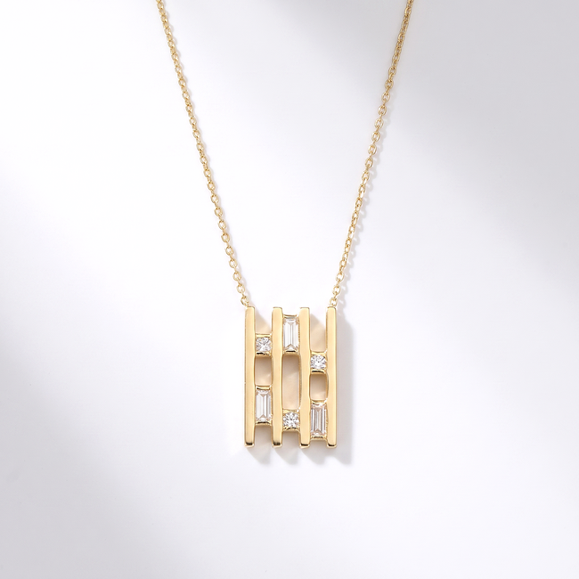 Gouden collier met geometrische hanger