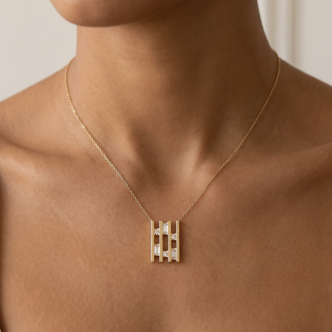 Gouden collier met geometrische hanger