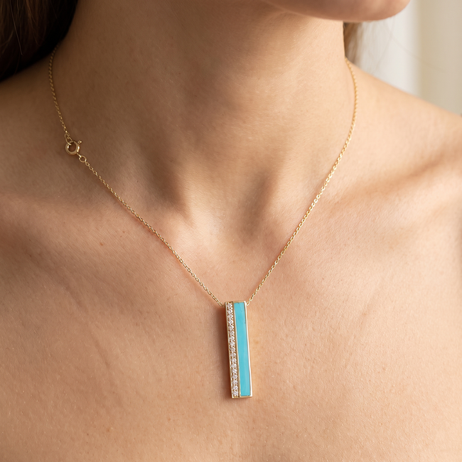 Gouden collier met turquoise balk hanger