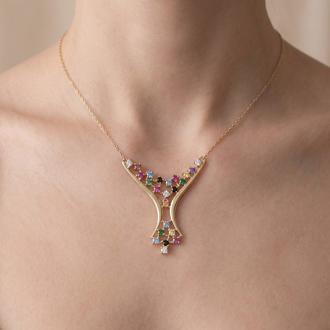 Gouden ketting met gekleurde zirkonia en design