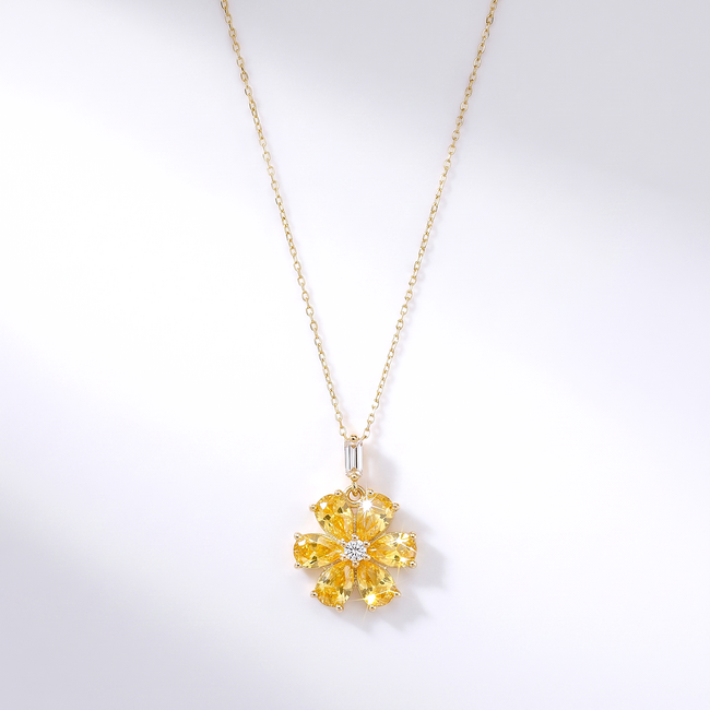 Gouden bloem ketting met gele zirkonia stenen