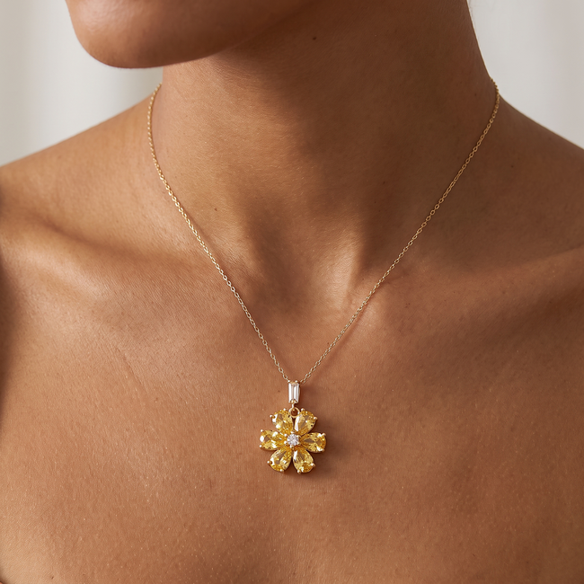Gouden bloem ketting met gele zirkonia stenen