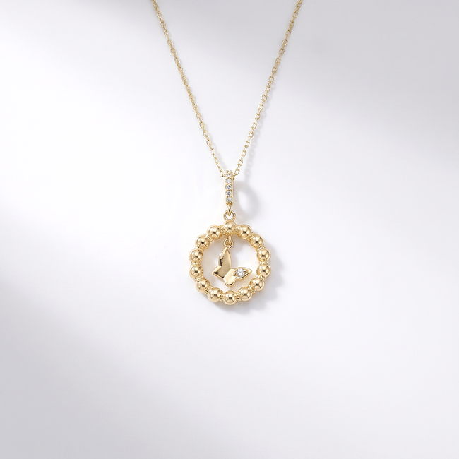 Gouden collier met vlinder hanger en zirkonia