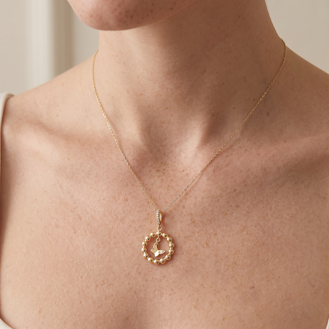 Gouden collier met vlinder hanger en zirkonia