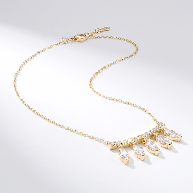 Gouden collier met hangende baguette stenen
